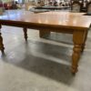 Simple Oak Toned Spun Pillar Legged Dining Table