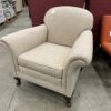 Creamy Colored Cloth Roll Arm Accent Chair